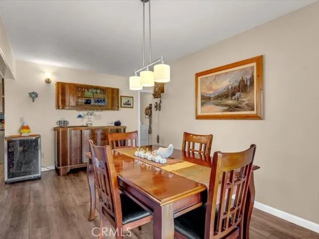 a kitchen with stainless steel appliances granite countertop a stove and white cabinets