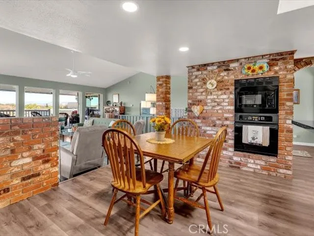 a bedroom with a bed and a chandelier fan