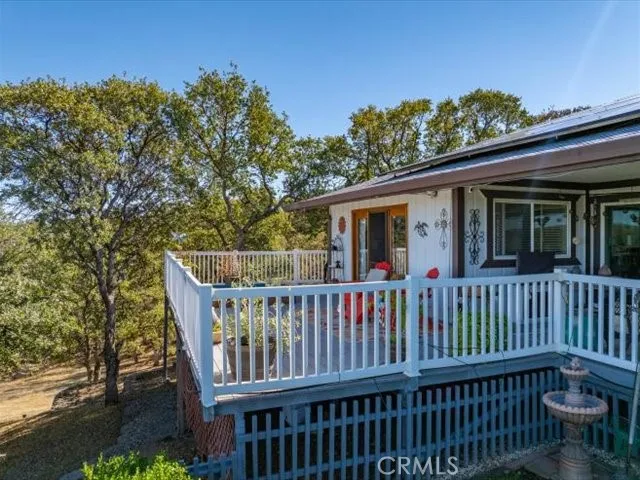 a view of a roof deck with wooden floor and fence