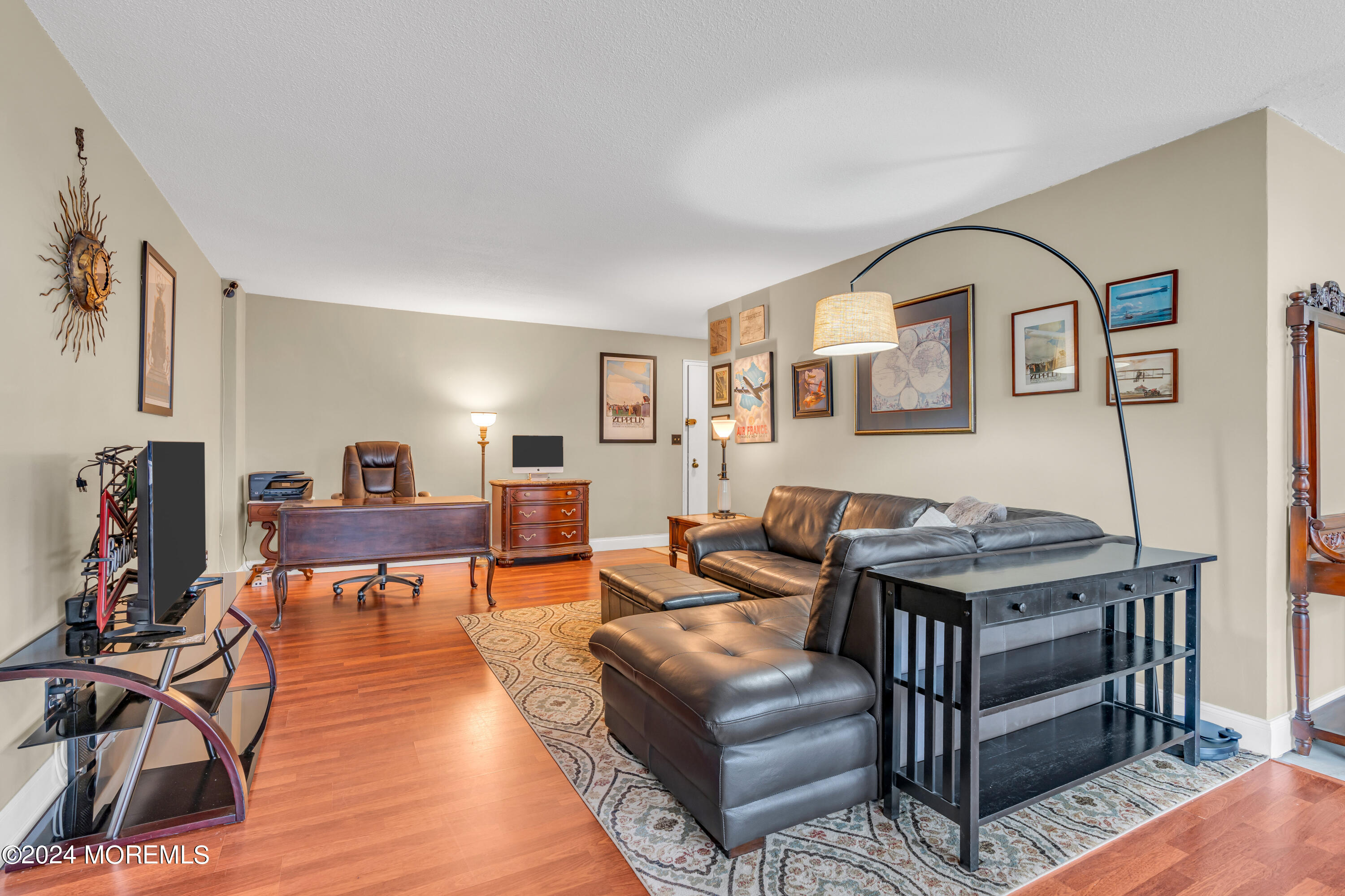 28 Riverside Avenue, Unit 7J Red Bank, NJ 07701 - Photo 5 of 25 a living room with furniture and wooden floor
