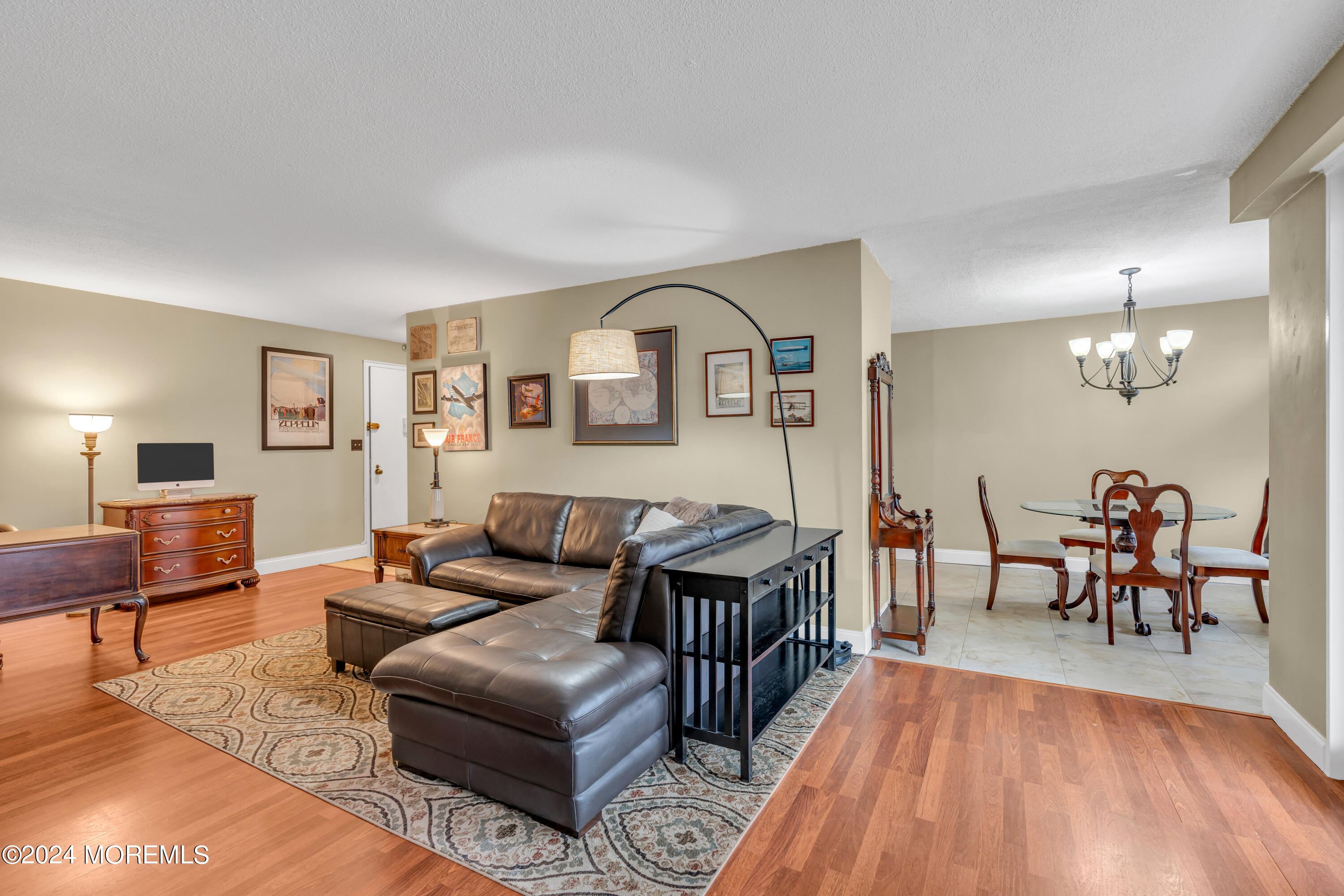 28 Riverside Avenue, Unit 7J Red Bank, NJ 07701 - Photo 6 of 25 a living room with furniture and a wooden floor