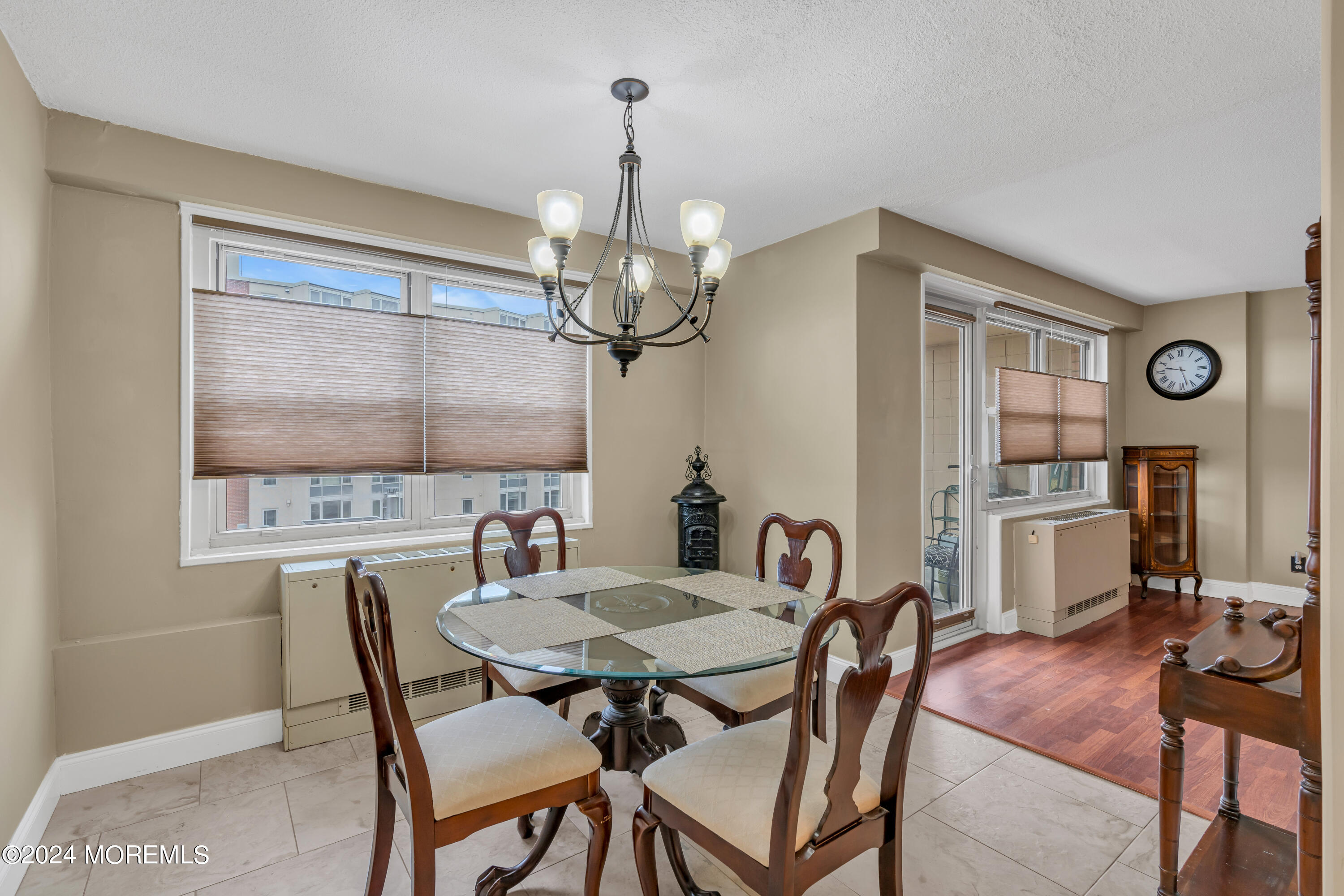 28 Riverside Avenue, Unit 7J Red Bank, NJ 07701 - Photo 7 of 25 a view of a dining room with furniture and chandelier