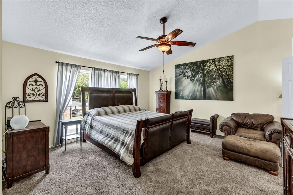 720 Bridget Way Hurst, TX 76054 - Photo 21 of 40 a bedroom with a bed couch and window