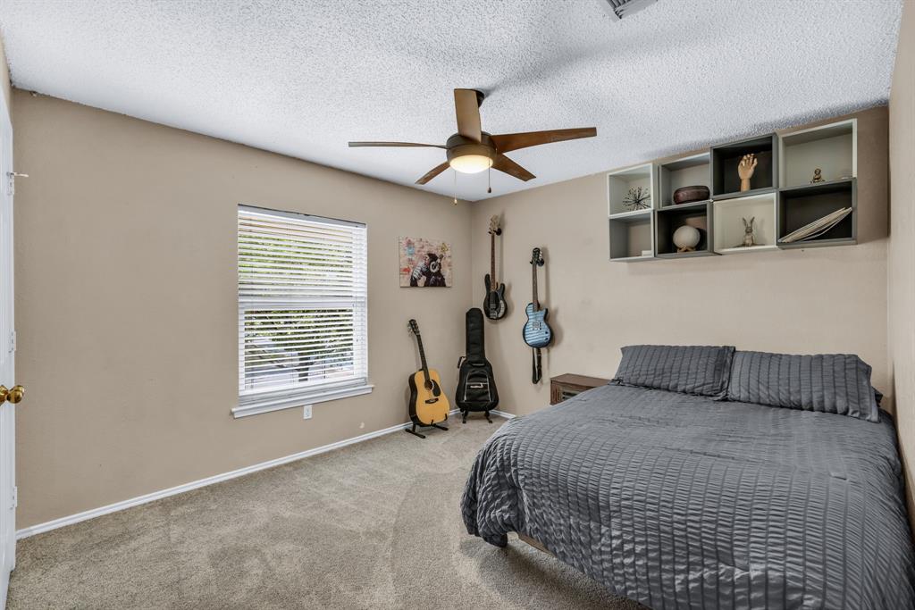 720 Bridget Way Hurst, TX 76054 - Photo 28 of 40 a bedroom with a bed a window and closet