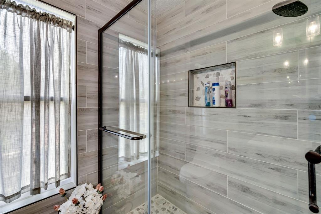 720 Bridget Way Hurst, TX 76054 - Photo 30 of 40 a bathroom with a shower