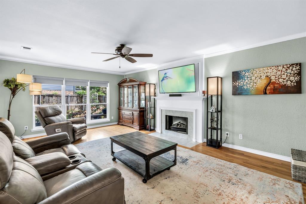 720 Bridget Way Hurst, TX 76054 - Photo 3 of 40 a living room with furniture and a fireplace