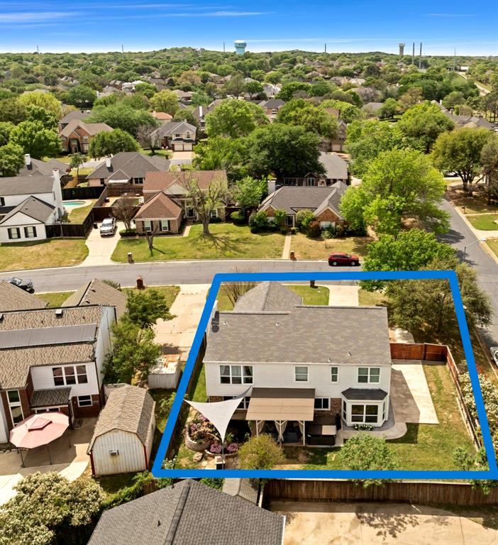 720 Bridget Way Hurst, TX 76054 - Photo 37 of 40 an aerial view of multiple houses with a swimming pool