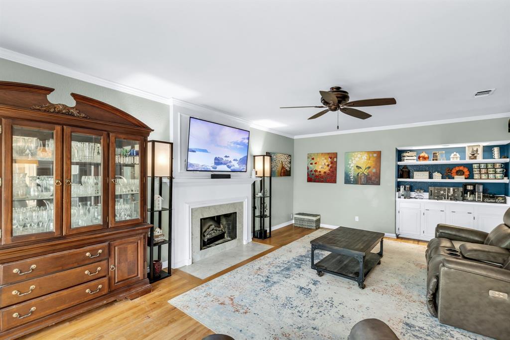 720 Bridget Way Hurst, TX 76054 - Photo 6 of 40 a living room with furniture and a fireplace