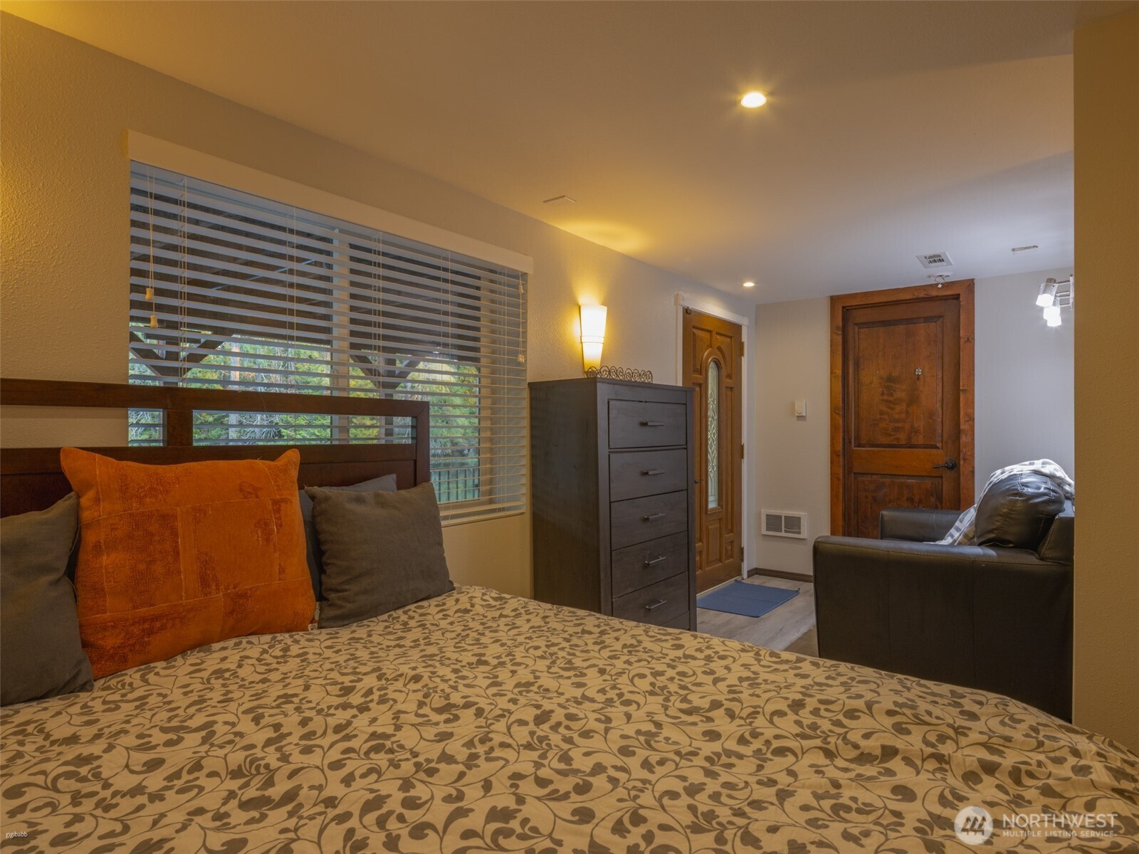 5440 East Grapeview Loop Road Allyn, WA 98524 - Photo 12 of 32 a bedroom with a bed and furniture