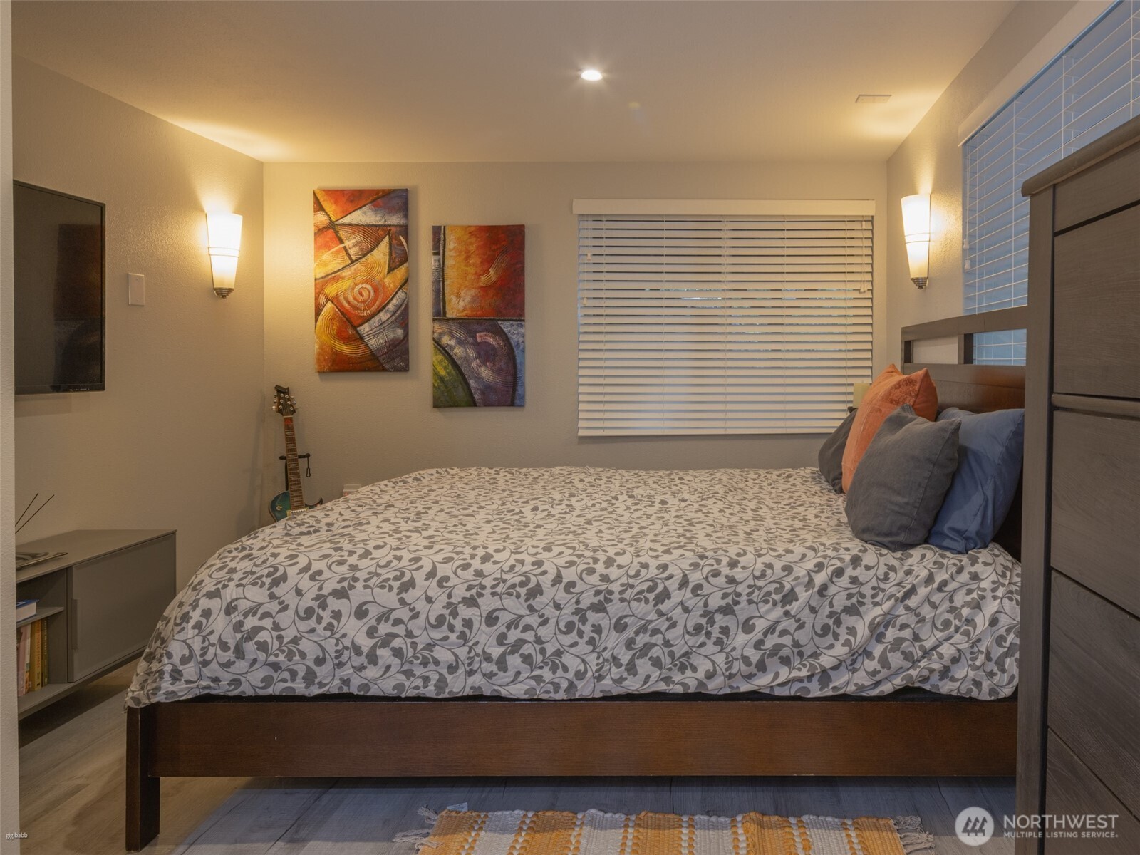 5440 East Grapeview Loop Road Allyn, WA 98524 - Photo 13 of 32 a bedroom with a large bed and a window