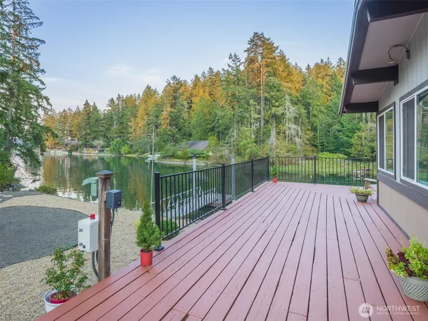 a view of a balcony with wooden floor and outdoor space