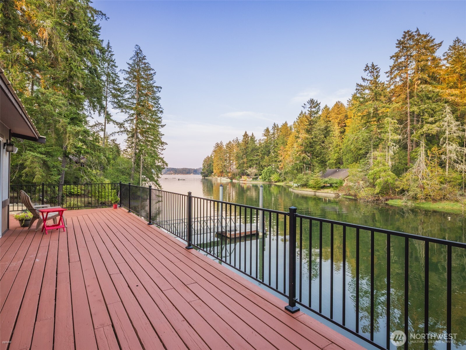 5440 East Grapeview Loop Road Allyn, WA 98524 - Photo 19 of 30 a view of balcony with wooden floor and outdoor space