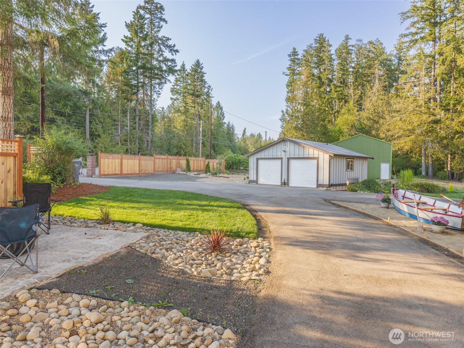 5440 East Grapeview Loop Road Allyn, WA 98524 - Photo 24 of 30 a house with swimming pool in front of it