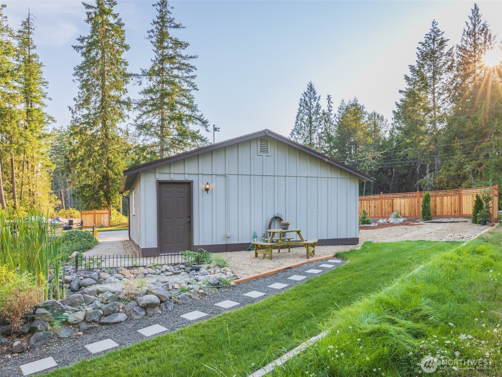5440 East Grapeview Loop Road Allyn, WA 98524 - Photo 25 of 30 a house view with a sitting space and garden