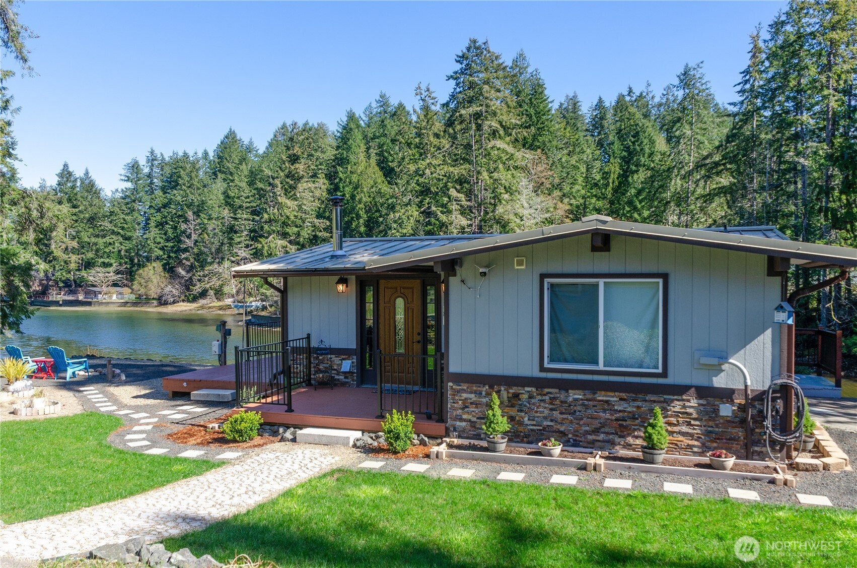 5440 East Grapeview Loop Road Allyn, WA 98524 - Photo 30 of 32 a view of a backyard with a patio