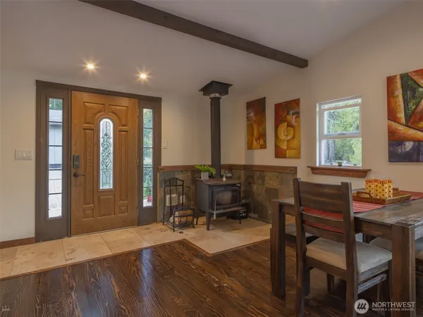 a workspace with furniture window and wooden floor