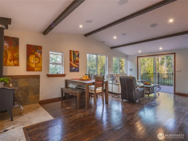 a view of a livingroom with furniture window and wooden floor