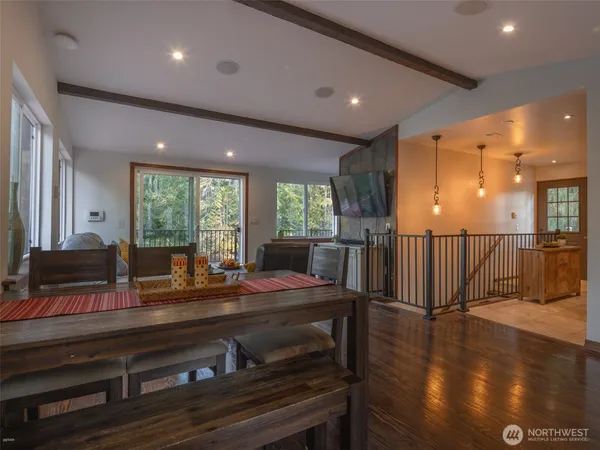 a view of a dining room with furniture window and wooden floor