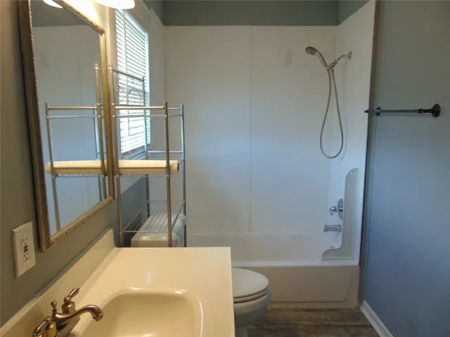 a kitchen with a stove and a refrigerator