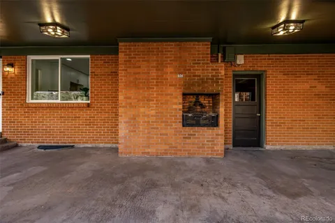 a view of an empty room with windows