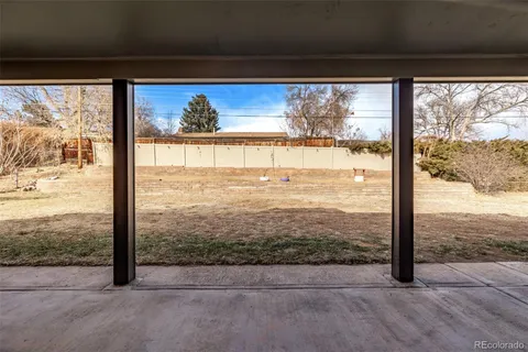 a view of a glass door and an outdoor space
