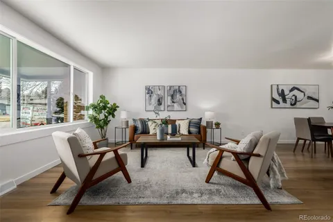 a work room with furniture and a potted plant