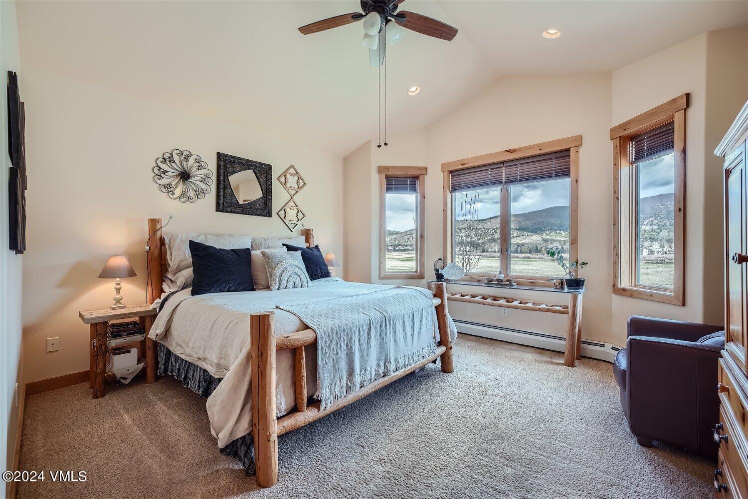 104 North Brett Edwards, CO 81632 - Photo 15 of 32 a bedroom with a bed and a chandelier