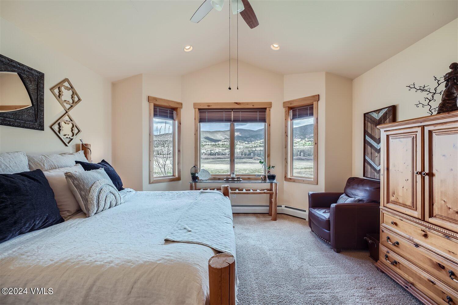 104 North Brett Edwards, CO 81632 - Photo 16 of 32 a spacious bedroom with a bed a couch and large window