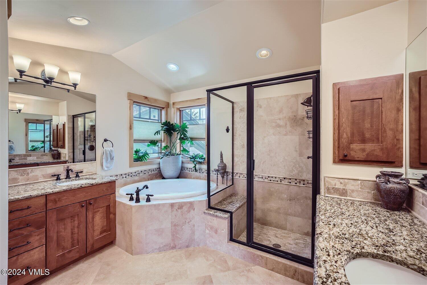 104 North Brett Edwards, CO 81632 - Photo 17 of 32 a large bathroom with a tub shower and mirror