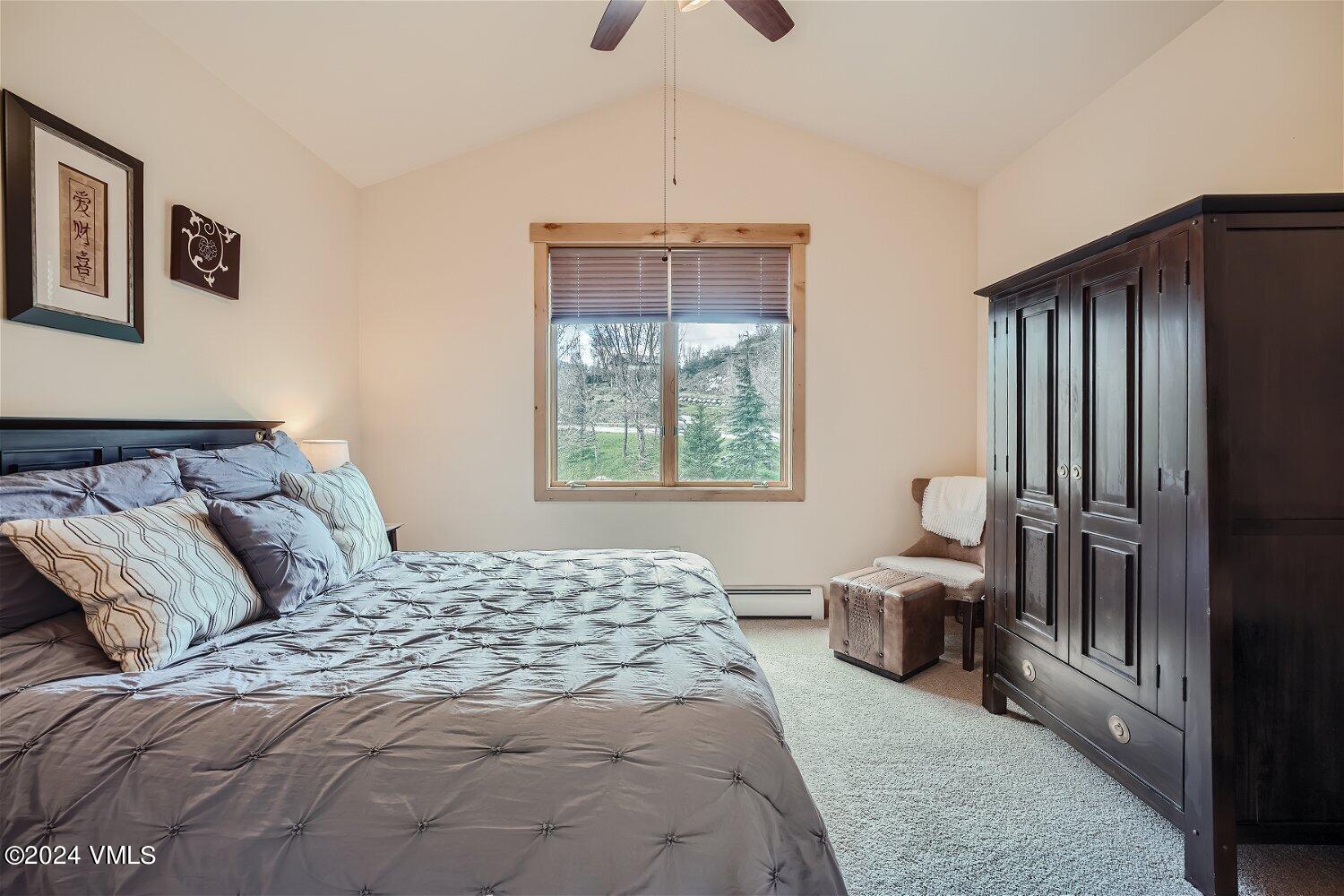 104 North Brett Edwards, CO 81632 - Photo 19 of 32 a bedroom with a large bed and a window