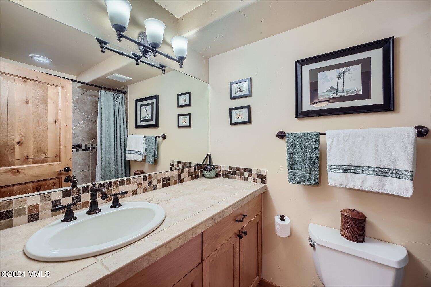 104 North Brett Edwards, CO 81632 - Photo 24 of 32 a bathroom with a sink double vanity and a mirror