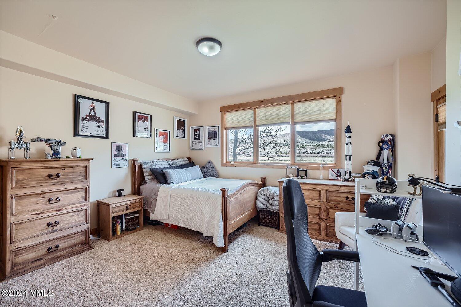 104 North Brett Edwards, CO 81632 - Photo 25 of 32 a room with a bed and a large window