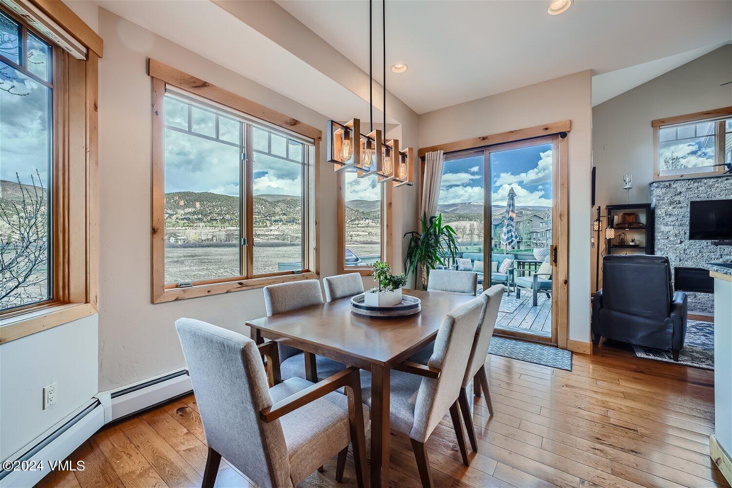 104 North Brett Edwards, CO 81632 - Photo 8 of 32 a view of a dining room with furniture window and wooden floor