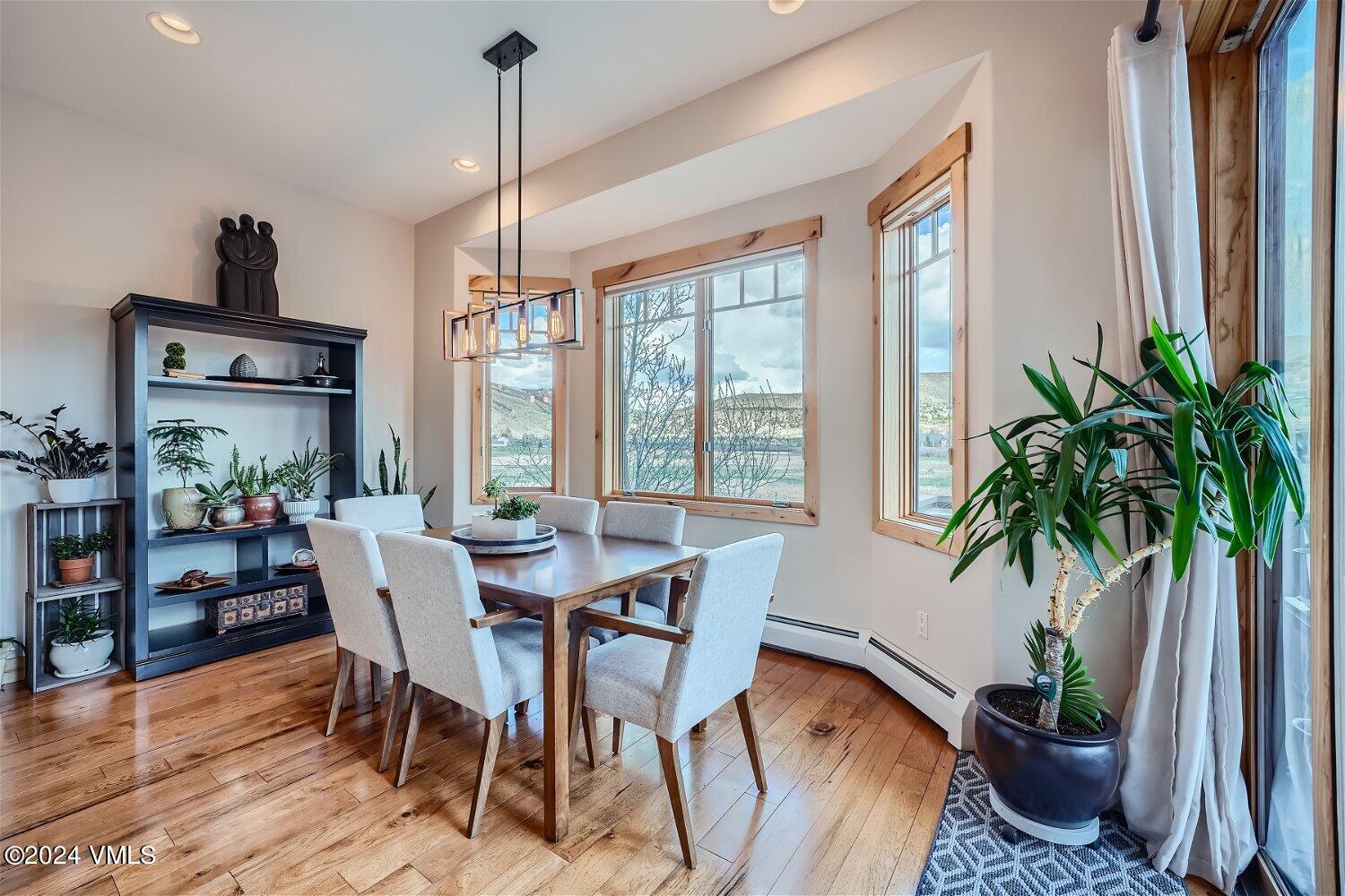 104 North Brett Edwards, CO 81632 - Photo 9 of 32 a view of a dining room with furniture window and wooden floor