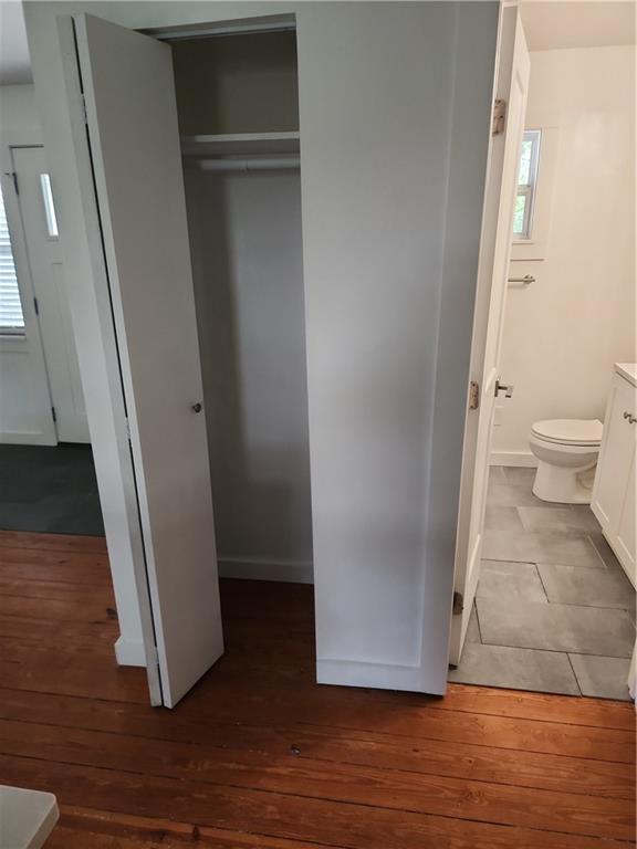 2037 A Lively Ridge Road Northeast Atlanta, GA 30329 - Photo 12 of 15 a view of an empty room with wooden floor and a window