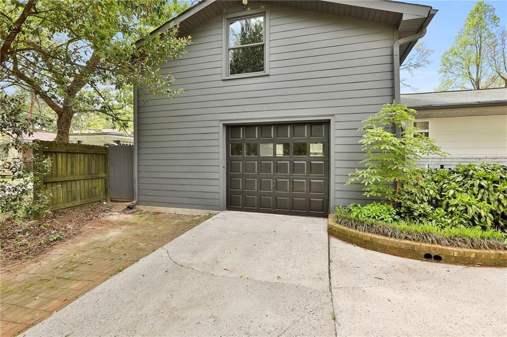 2037 A Lively Ridge Road Northeast Atlanta, GA 30329 - Photo 15 of 15 a front view of a house with a yard and garage