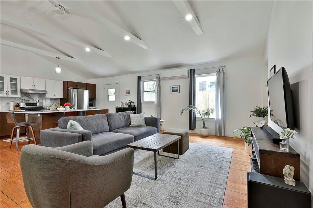 2037 A Lively Ridge Road Northeast Atlanta, GA 30329 - Photo 2 of 15 a living room with furniture and a flat screen tv