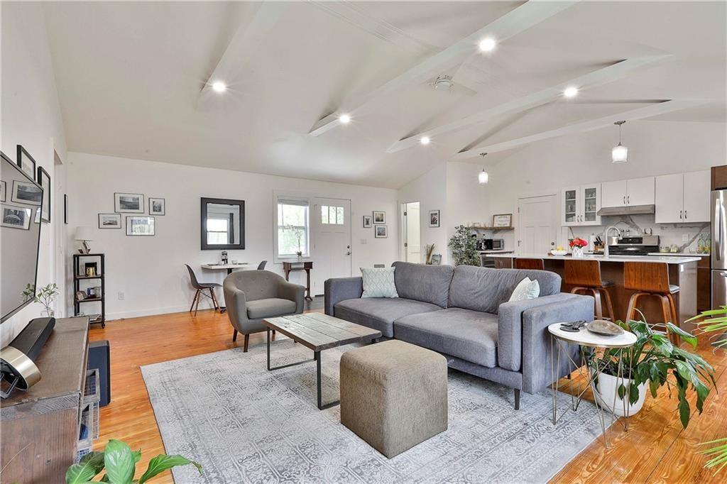 2037 A Lively Ridge Road Northeast Atlanta, GA 30329 - Photo 3 of 15 a living room with furniture kitchen view and a table