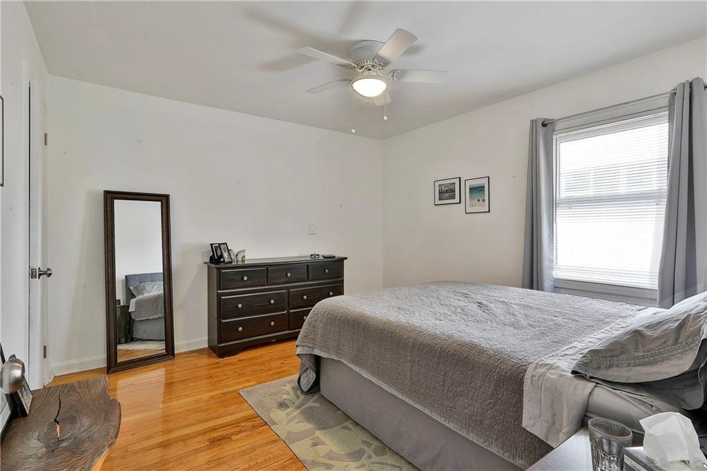 2037 A Lively Ridge Road Northeast Atlanta, GA 30329 - Photo 6 of 15 a bedroom with a bed and a chandelier