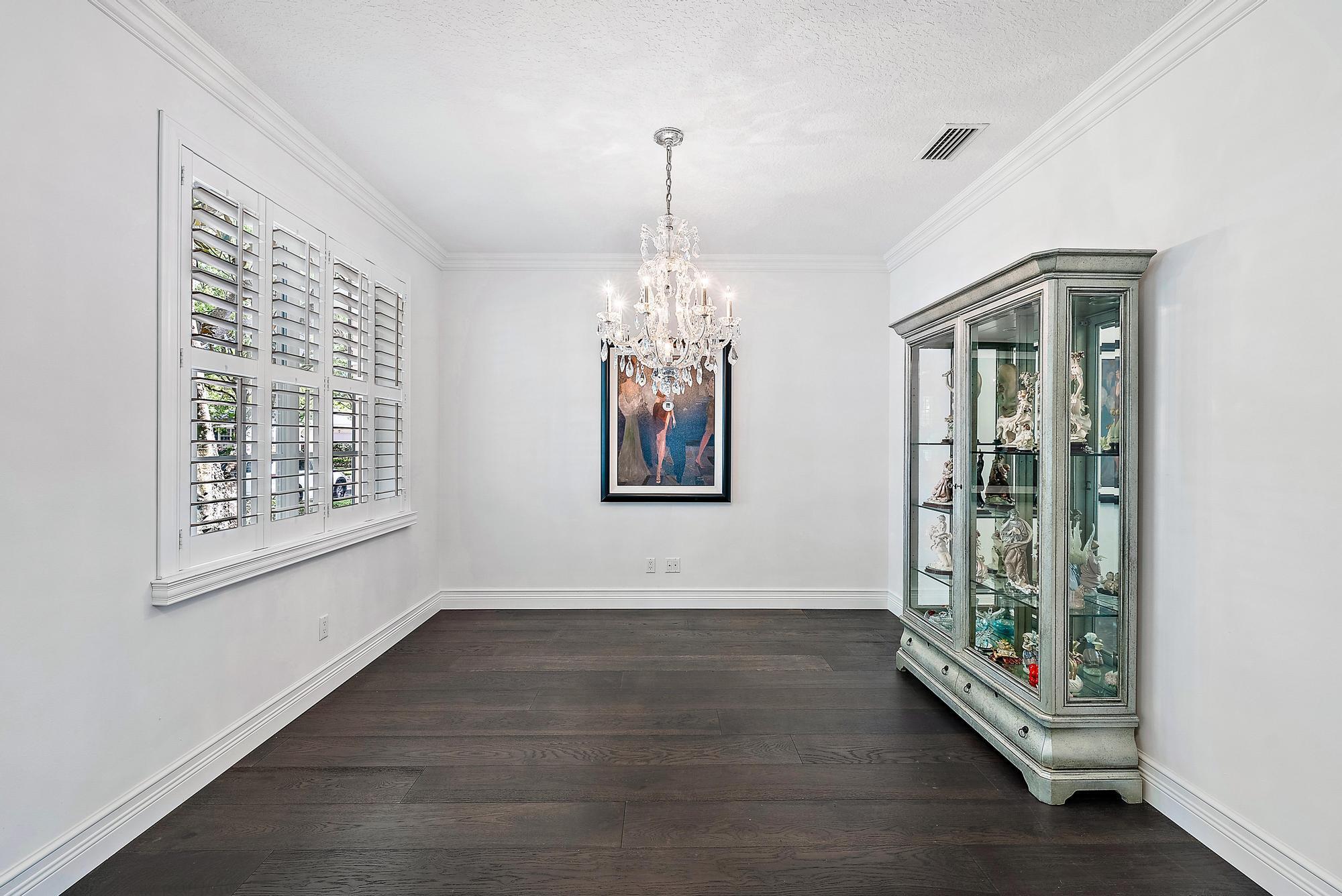 312 Bougainvillea Drive Jupiter, FL 33458 - Photo 14 of 44 a view of an empty room with window and wooden floor