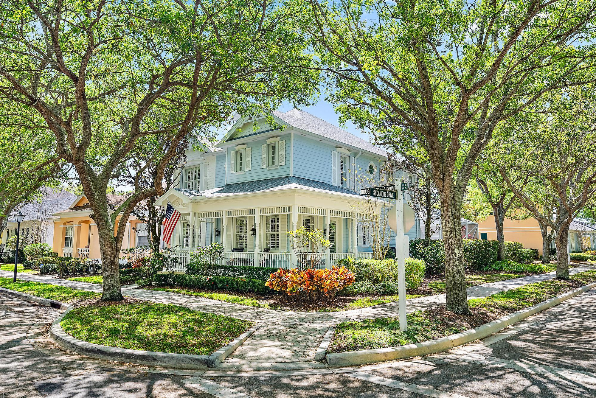 312 Bougainvillea Drive Jupiter, FL 33458 - Photo 2 of 44 a front view of a house with garden