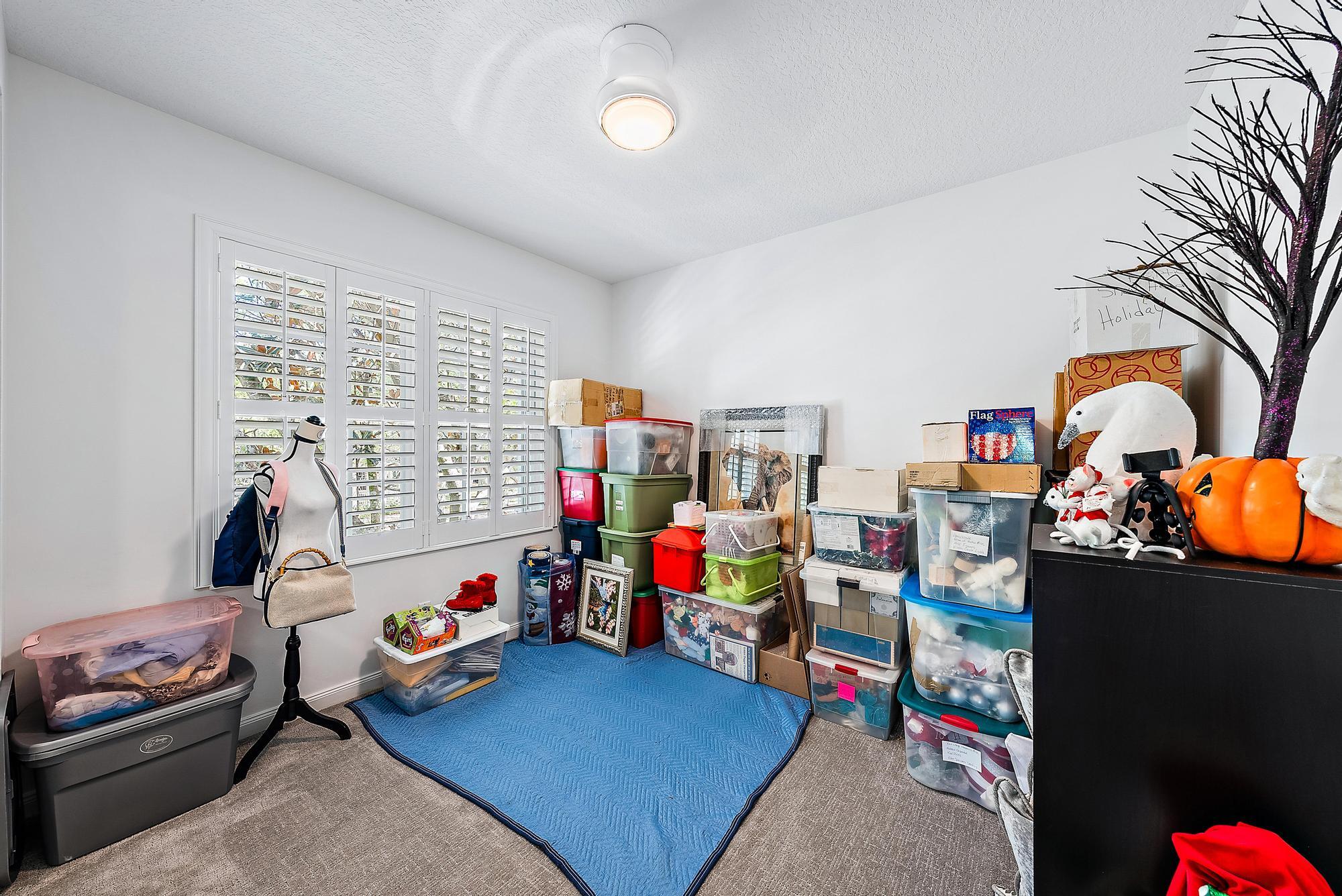 312 Bougainvillea Drive Jupiter, FL 33458 - Photo 29 of 44 a kids room with toys and toys