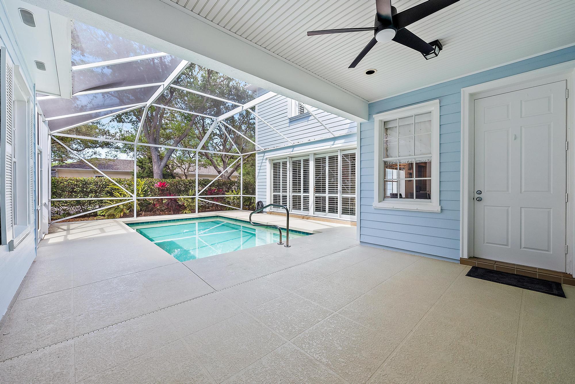 312 Bougainvillea Drive Jupiter, FL 33458 - Photo 31 of 44 a view of a room with wooden floor and windows