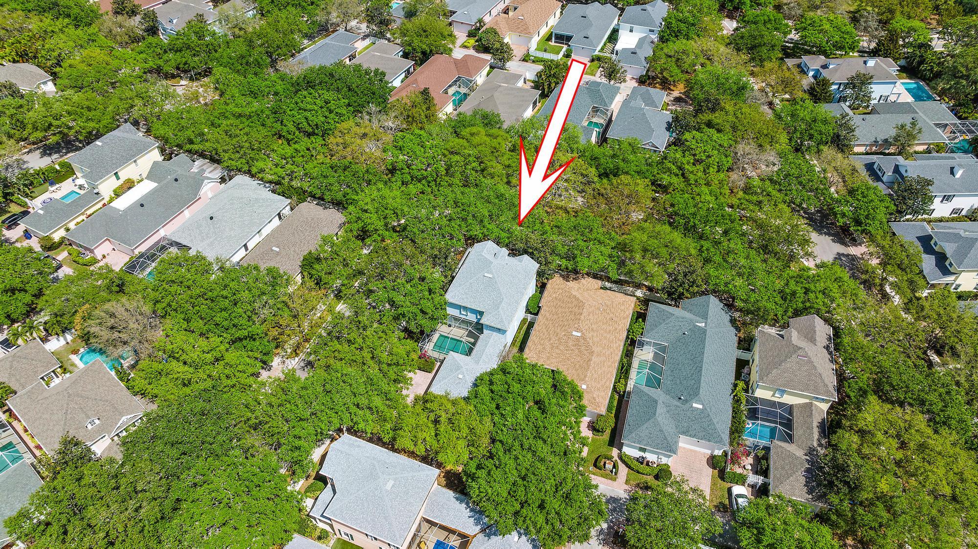 312 Bougainvillea Drive Jupiter, FL 33458 - Photo 34 of 44 an aerial view of a house with a yard and lake view