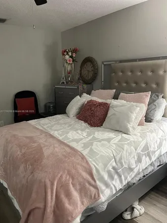 a bedroom with a bed and a stove