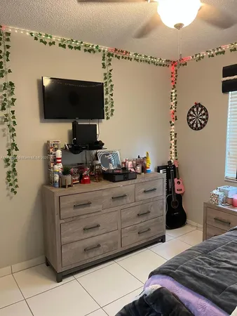 a bathroom with a sink mirror and vanity