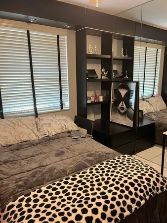 a bathroom with a sink vanity and a mirror