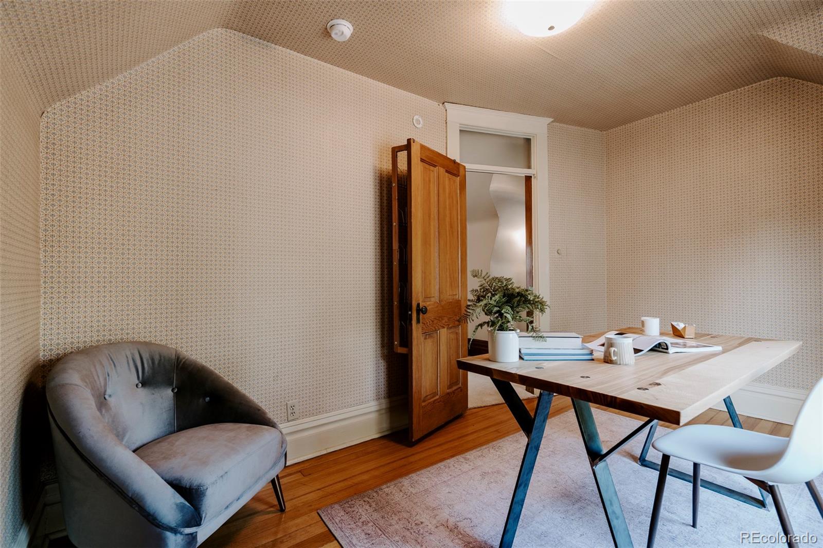 1718 Mapleton Avenue Boulder, CO 80302 - Photo 22 of 39 a work room with furniture and wooden floor