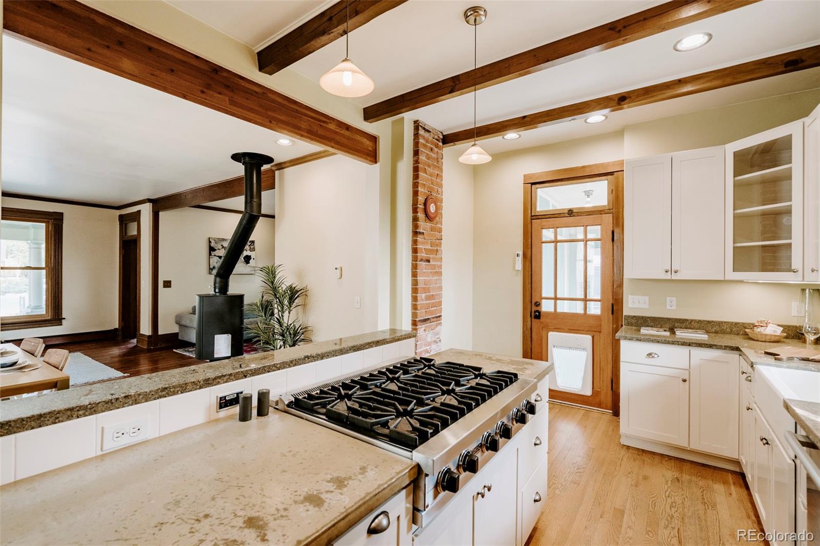 1718 Mapleton Avenue Boulder, CO 80302 - Photo 7 of 39 a kitchen with stainless steel appliances granite countertop a sink stove and refrigerator
