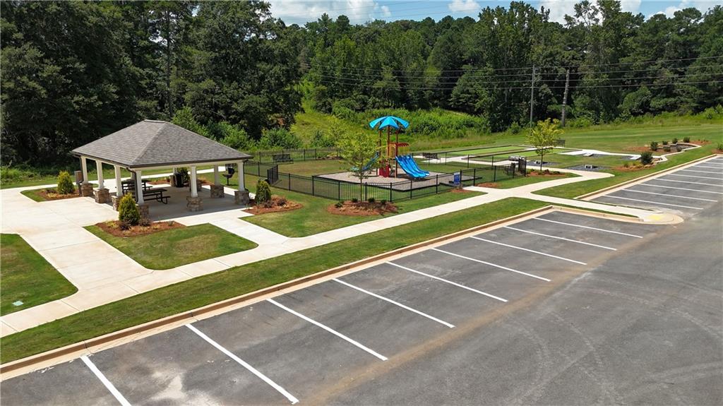 190 Otway Loop Winder, GA 30680 - Photo 16 of 17 a view of a tennis ground with large trees